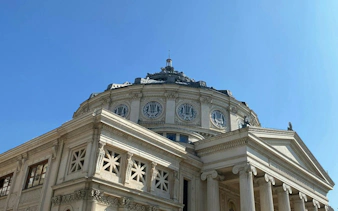 Romanian Athenaeum dome in Bucharest, part of the self-guided city exploration game.