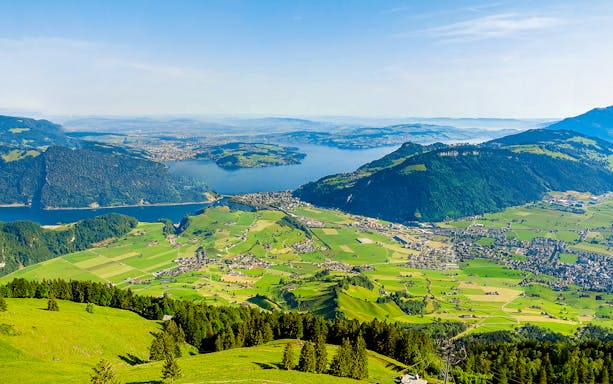 Aerial view of Mount Stanserhorn with lush valleys and Lake Lucerne in Switzerland.