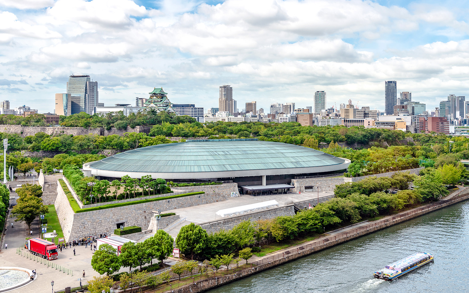 Osaka-jo Hall with Osaka Castle and city skyline in the background.