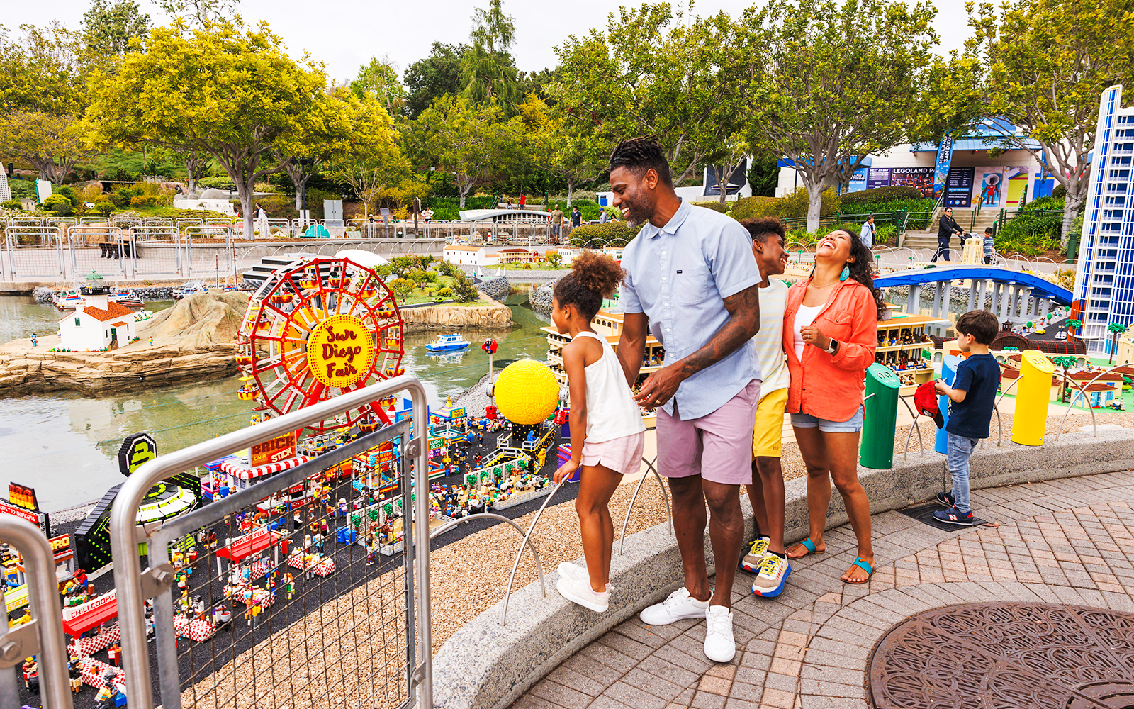 Family enjoying LEGO San Diego Fair display at MINILAND USA, LEGOLAND California.