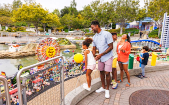 Family enjoying LEGO San Diego Fair display at MINILAND USA, LEGOLAND California.
