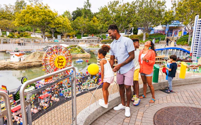 Family enjoying LEGO San Diego Fair display at MINILAND USA, LEGOLAND California.