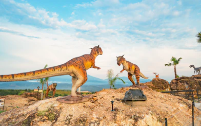 Dinosaurs in a desert landscape at Dino Desert attraction.