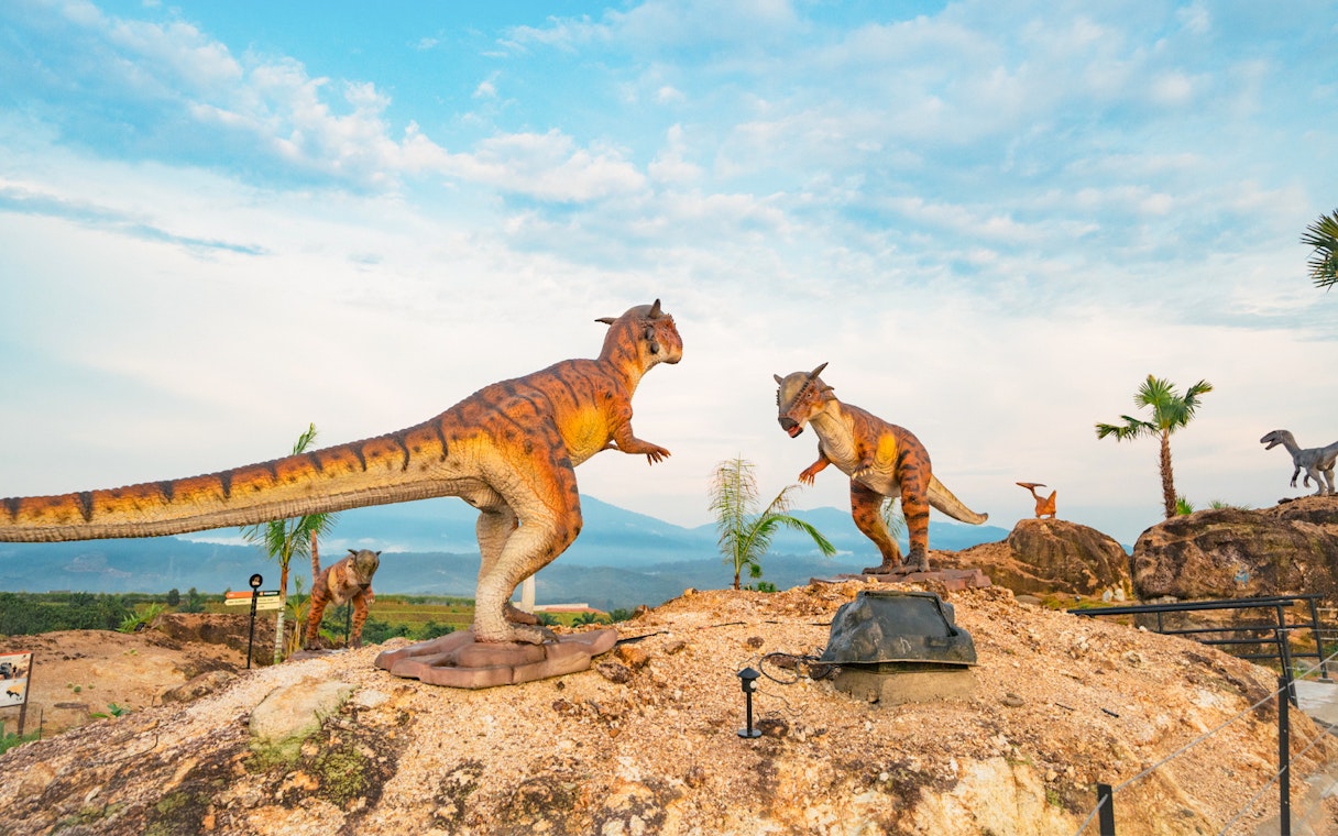 Dinosaurs in a desert landscape at Dino Desert attraction.