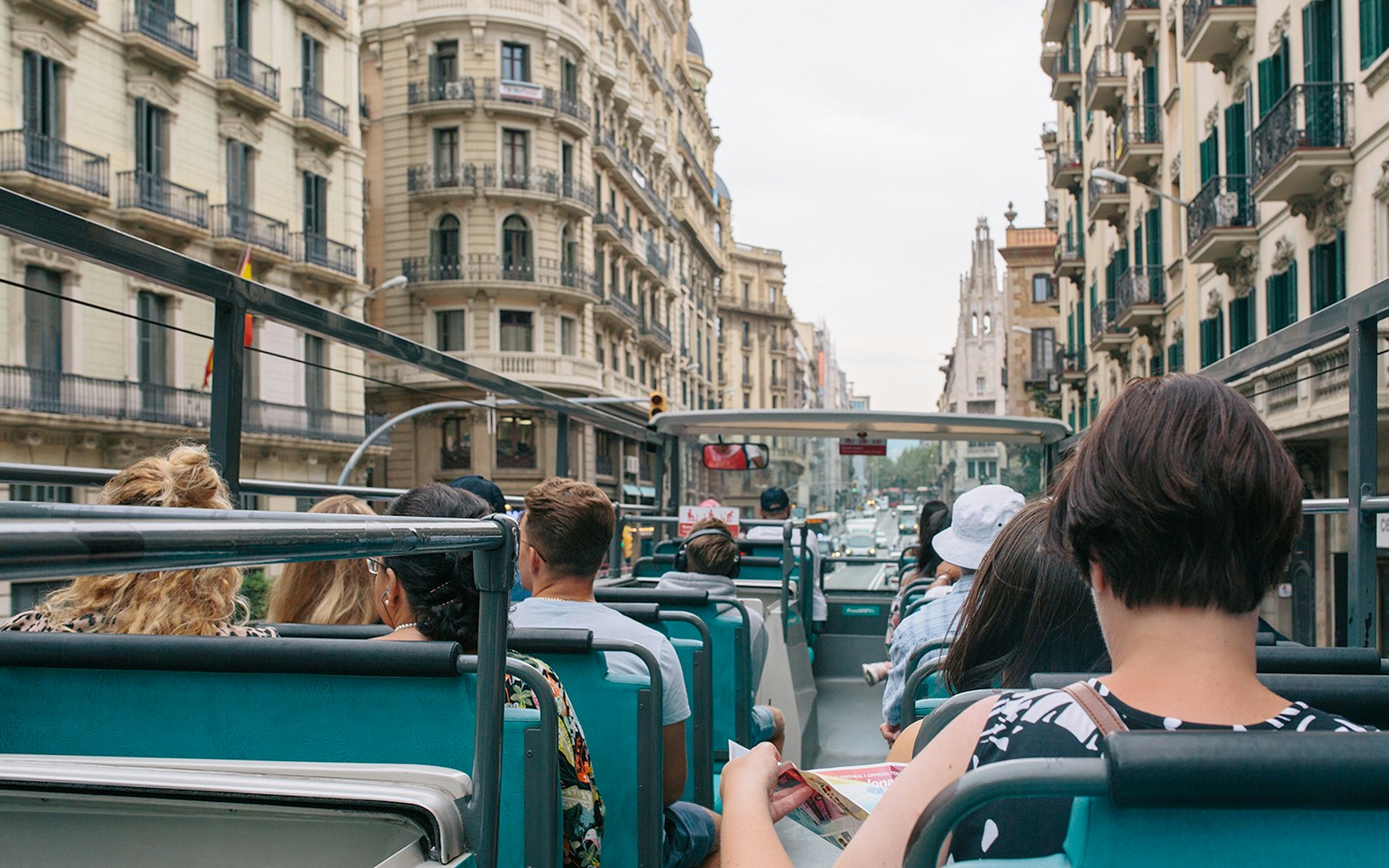 Tourists exploring Barcelona city with the Hola Barcelona Travel Card Pass for 2 to 5 days, visiting famous landmarks and enjoying local experiences