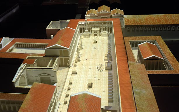 Model of ancient Pompeii courtyard with red-tiled roofs at Magic Ancient Pompeii Virtual Museum.