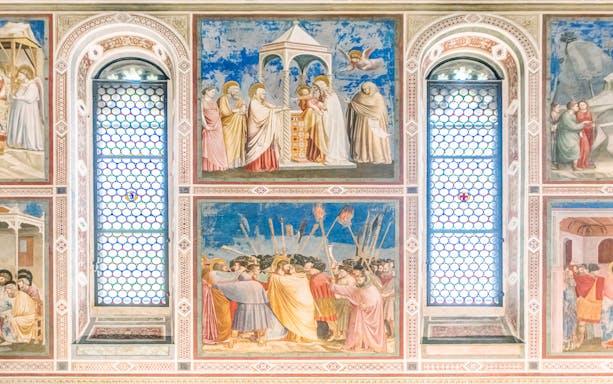 Frescoes inside Giotto Scrovegni Chapel, Padua, depicting biblical scenes.