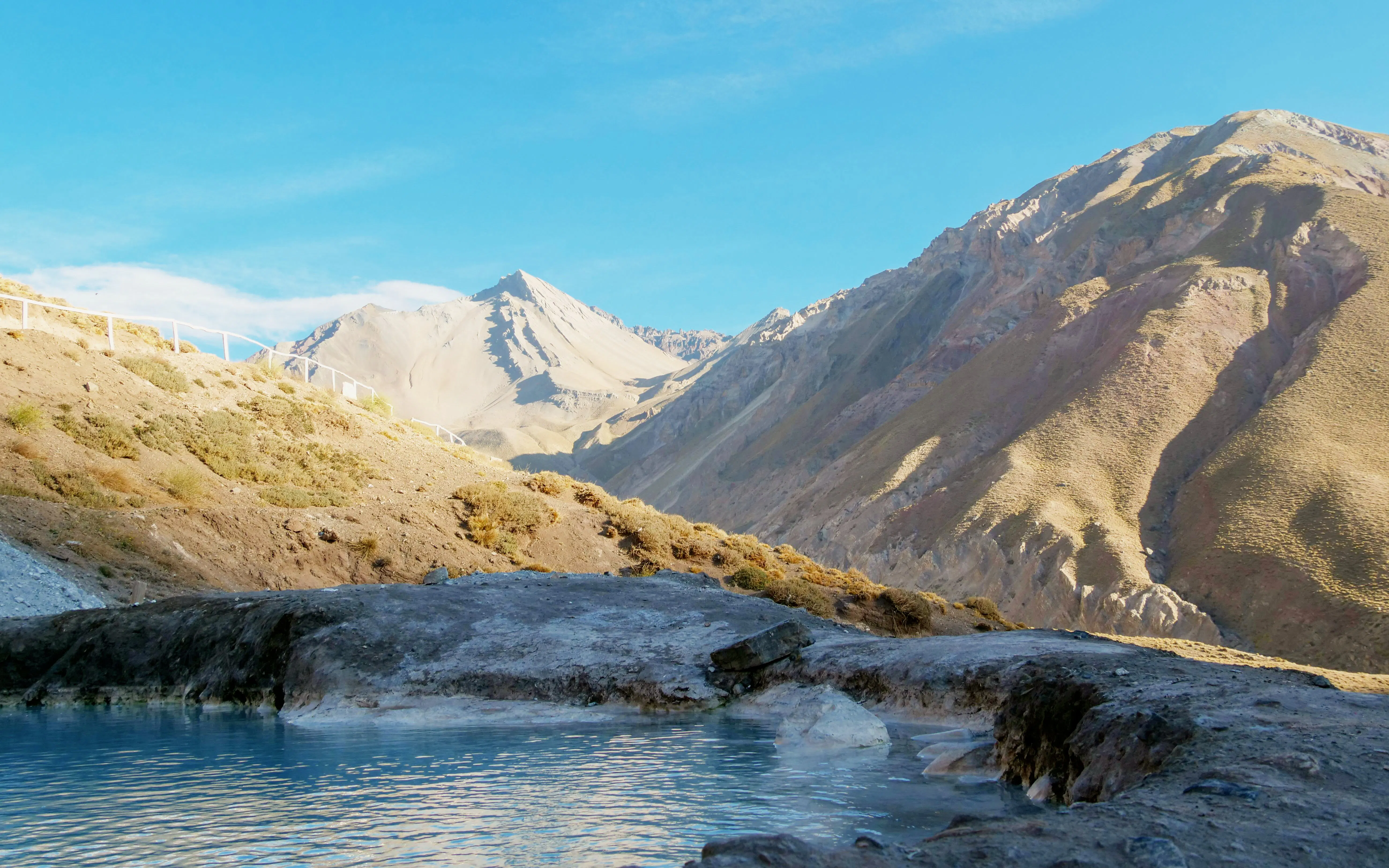 Termas Valle de Colina hot springs with Andes mountains in Cajón del Maipo, Chile.