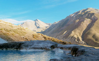 Termas Valle de Colina hot springs with Andes mountains in Cajón del Maipo, Chile.