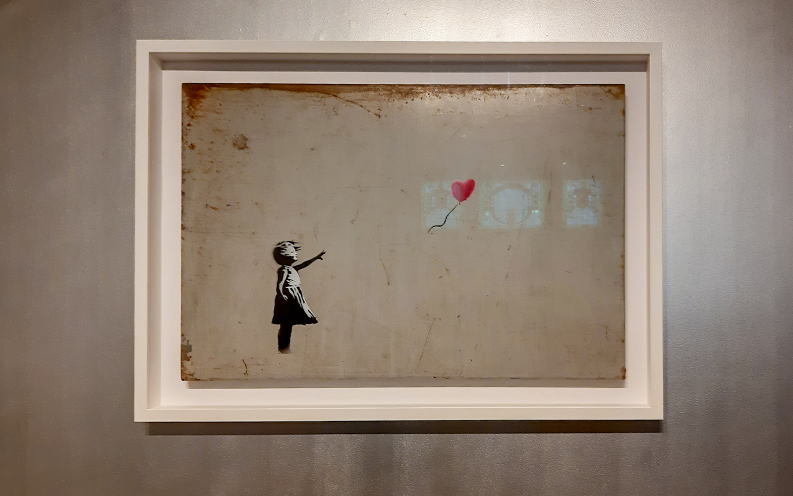 Girl with Balloon artwork by Banksy at Moco Museum, Amsterdam.