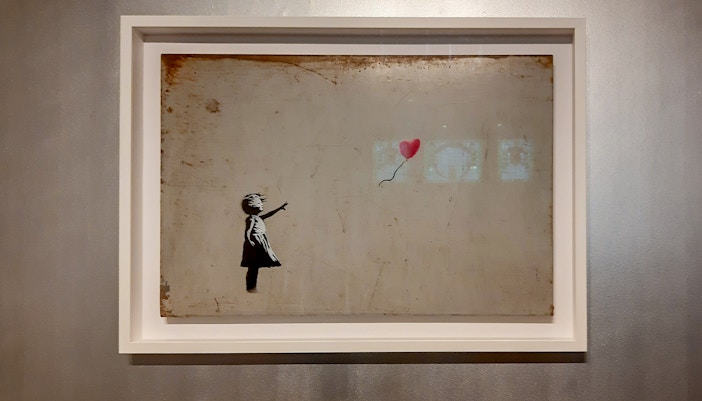 Girl with Balloon artwork by Banksy at Moco Museum, Amsterdam.