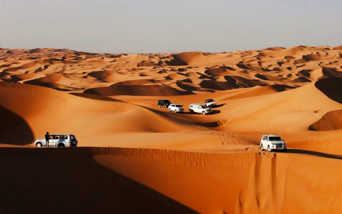 Dubai Red Dunes Desert Safari with BBQ Dinner, Camel Ride, Sandboarding and Hotel Transfers