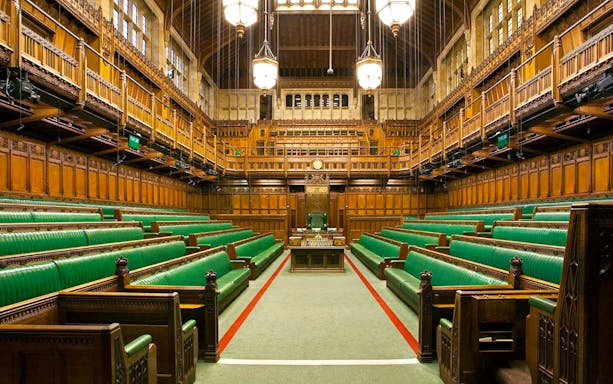 Houses of Parliament interior with green benches, part of the exclusive guided tour in Westminster, London.