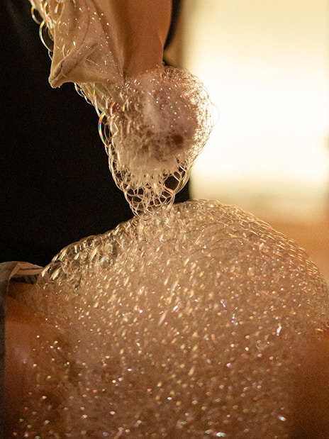 Visitors enjoying a bubble bath in a traditional Hammam in Granada.