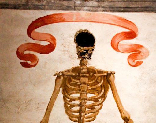 Early Christian frescoes and mosaics inside Catacombs of San Gaudioso, Naples, showcasing ancient frescoes and burial sites.