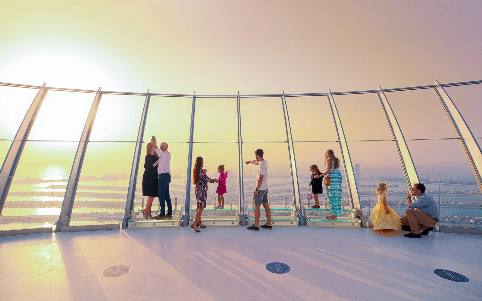Visitors enjoying panoramic views from the Palm Tower observation deck in Dubai.