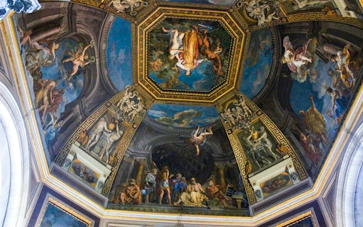 Vatican City ceiling fresco depicting mythological scenes and figures.