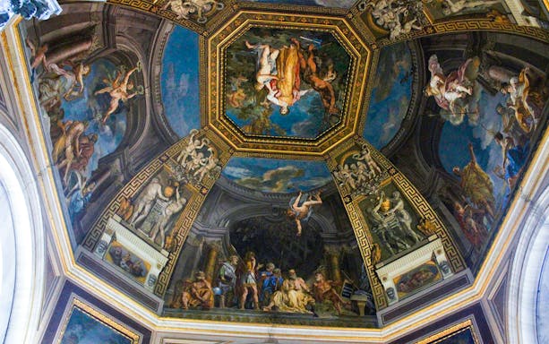 Vatican City ceiling fresco depicting mythological scenes and figures.