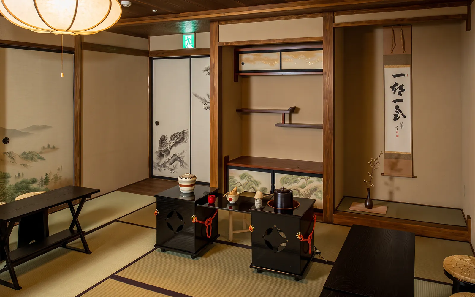 Traditional Japanese tea room setup for a tea ceremony in Shinjuku, featuring tatami mats and tea utensils.