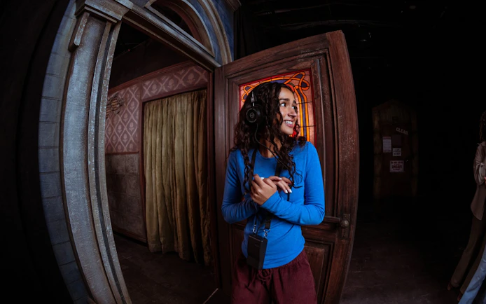 Visitor exploring Netflix's Stranger Things playhouse in Dallas.