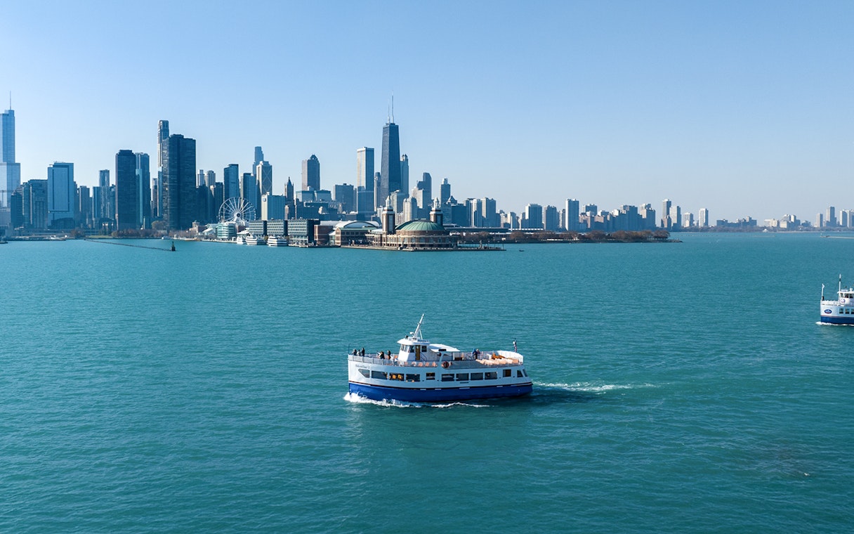 Cruise boat on Lake Michigan with Chicago skyline in the background.