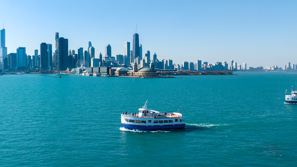 Cruise boat on Lake Michigan with Chicago skyline in the background.