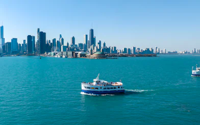 Cruise boat on Lake Michigan with Chicago skyline in the background.