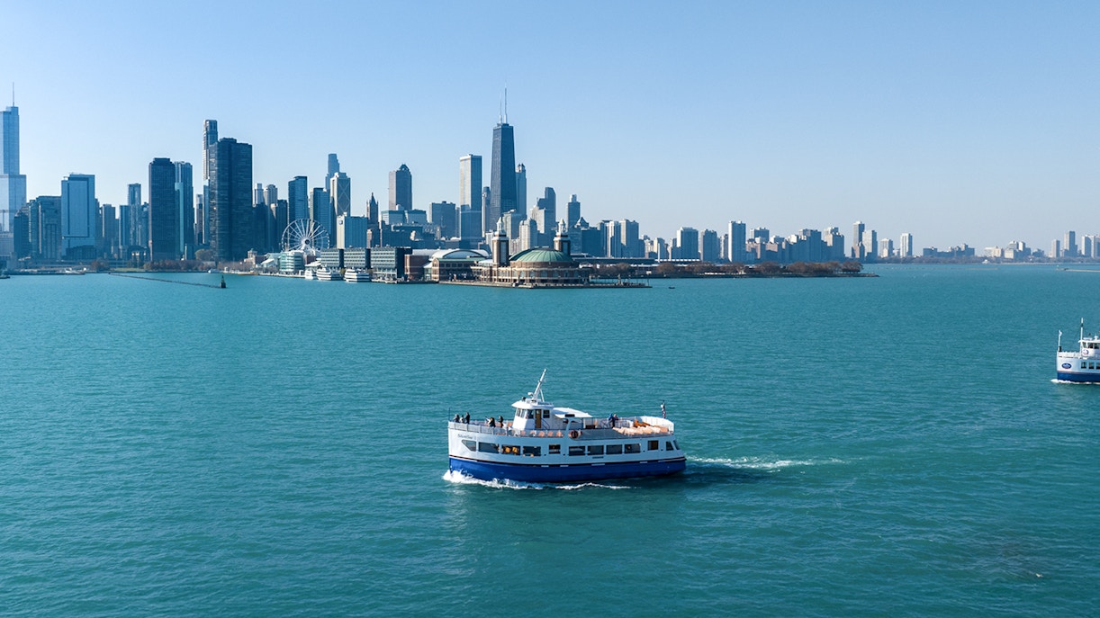 Cruise boat on Lake Michigan with Chicago skyline in the background.