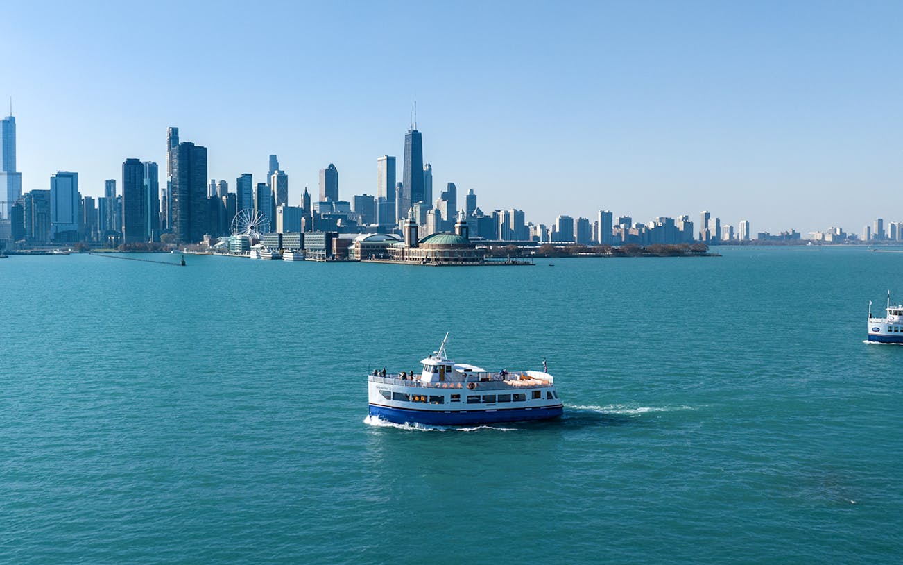 Cruise boat on Lake Michigan with Chicago skyline in the background.
