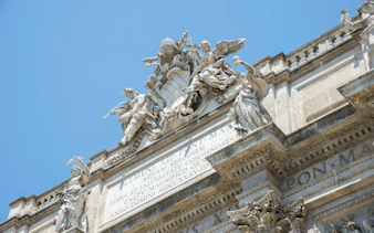 Top sculpture of angels at Trevi Fountain, Rome, Italy.