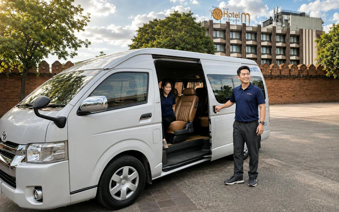 Private van transfer service in front of Hotel M Chiang Mai for Chiang Khong route.
