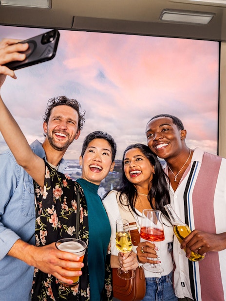 Group taking a selfie inside the ICON Park observation wheel in Orlando.