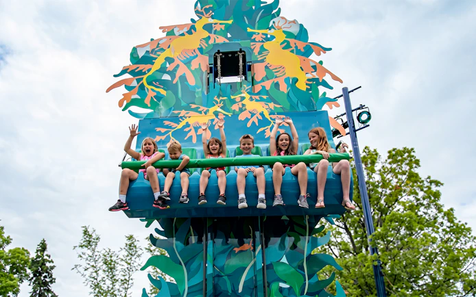 Children enjoying a colorful ride at SeaWorld San Diego.