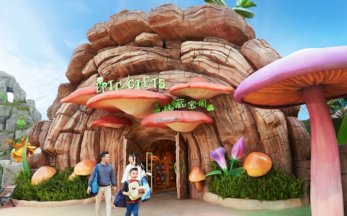 Family at the entrance of a themed gift shop at Genting SkyWorld Outdoor Theme Park.