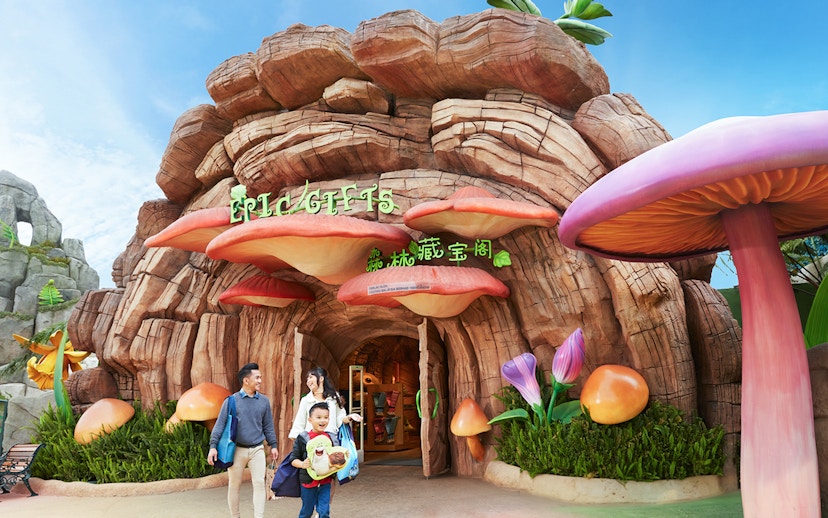 Family at the entrance of a themed gift shop at Genting SkyWorld Outdoor Theme Park.
