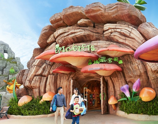 Family at the entrance of a themed gift shop at Genting SkyWorld Outdoor Theme Park.