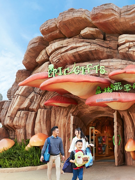 Family at the entrance of a themed gift shop at Genting SkyWorld Outdoor Theme Park.
