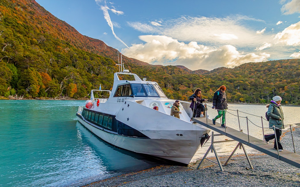 Passengers deboarding a boat for Mayo Spirit Trek on Lake Argentino, Patagonia, Argentina.
