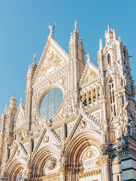 Siena Cathedral facade with intricate Gothic architecture, Tuscany.