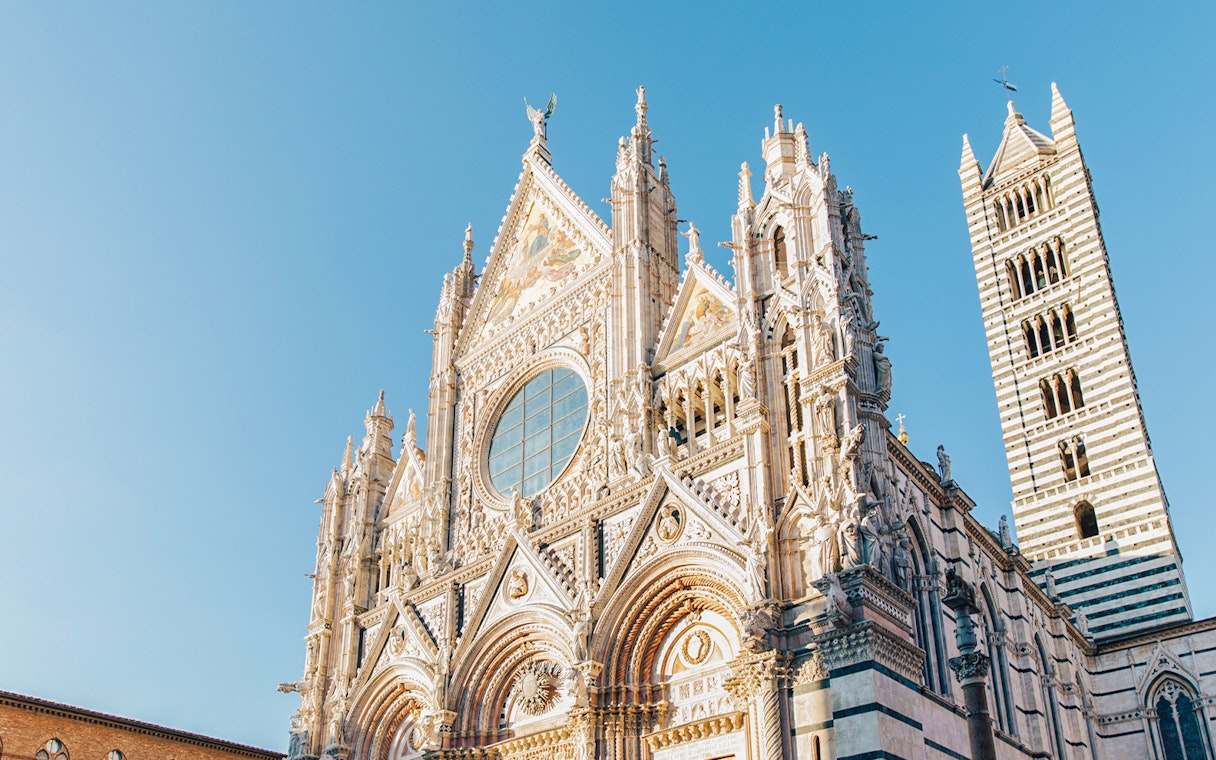 Siena Cathedral facade with intricate Gothic architecture, Tuscany.