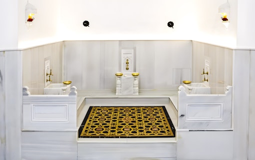 Hürrem Sultan Luxury Hamam interior with marble basins and ornate floor design near Hagia Sophia.