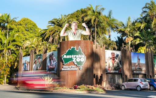 Australia Zoo entrance with iconic Crocodile Hunter signage and lush greenery.