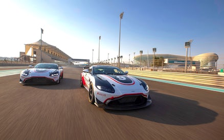 Aston Martin GT4 cars racing at Yas Marina Circuit, Abu Dhabi.