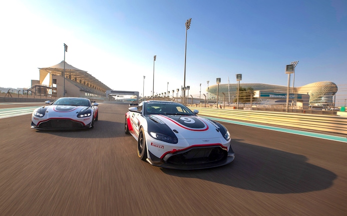 Aston Martin GT4 cars racing at Yas Marina Circuit, Abu Dhabi.