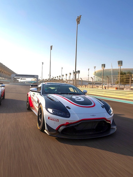 Aston Martin GT4 cars racing at Yas Marina Circuit, Abu Dhabi.