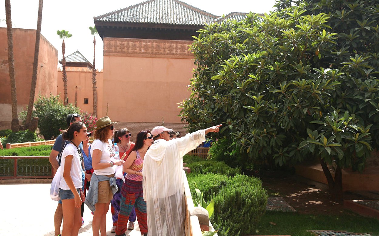 Tour group exploring gardens at Bahia Palace, Marrakech.