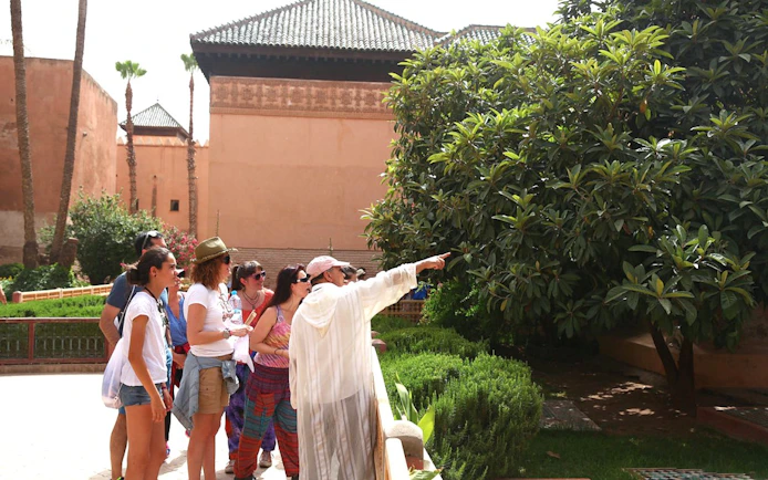 Tour group exploring gardens at Bahia Palace, Marrakech.