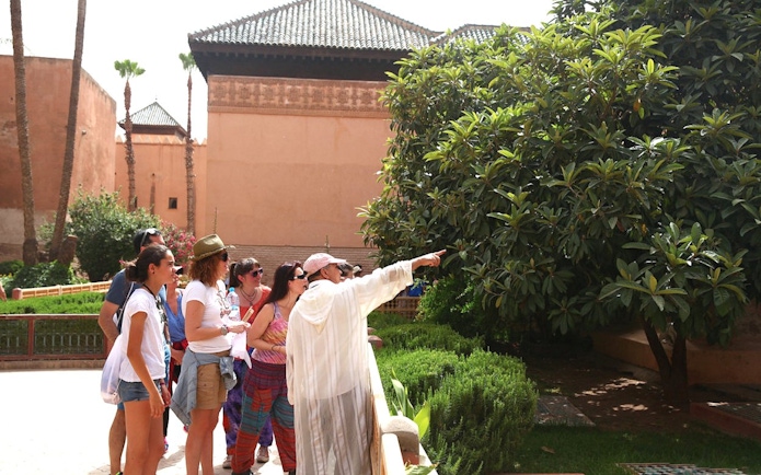 Tour group exploring gardens at Bahia Palace, Marrakech.