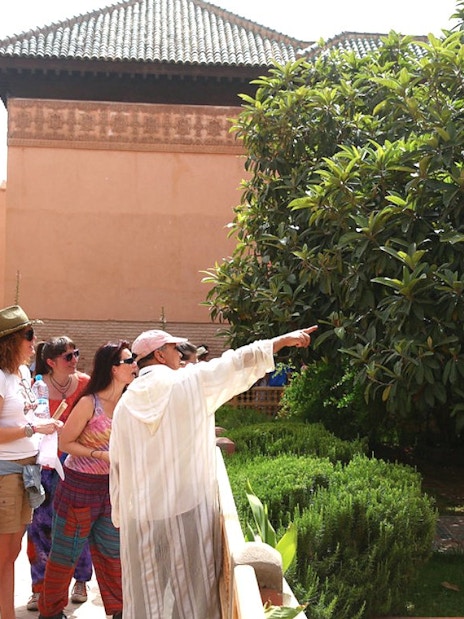 Tour group exploring gardens at Bahia Palace, Marrakech.