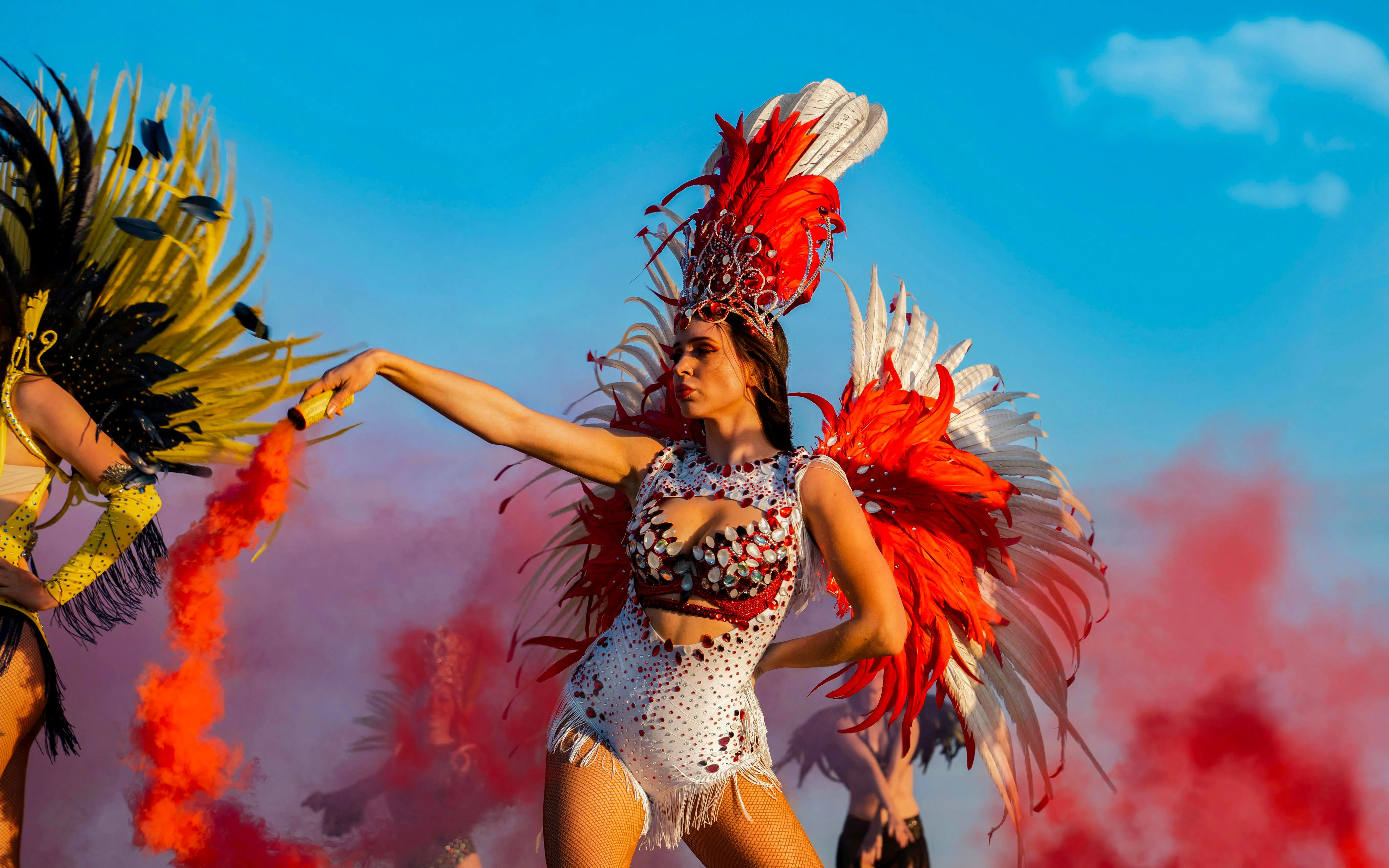 Carnival dancer in vibrant feathered costume at Rio Carnival.